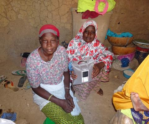 Two women with a new lantern.