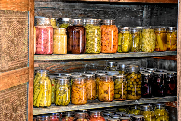Root cellar with preserved food in glass jars. Source: Ray Shrewsberry via Unsplash