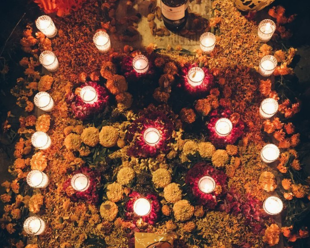 Marigolds and candles as ofrendas