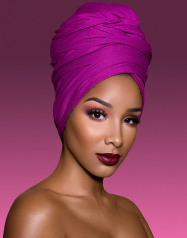 woman in purple turban wearing purple lipstick