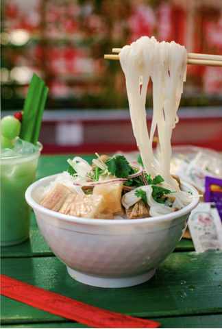 chopsticks holding up pho noodles