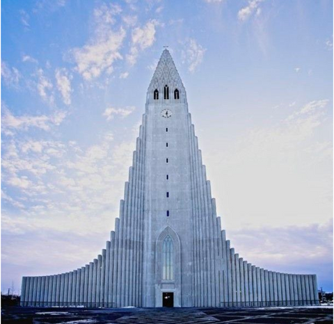 tall church with blue skies in the background