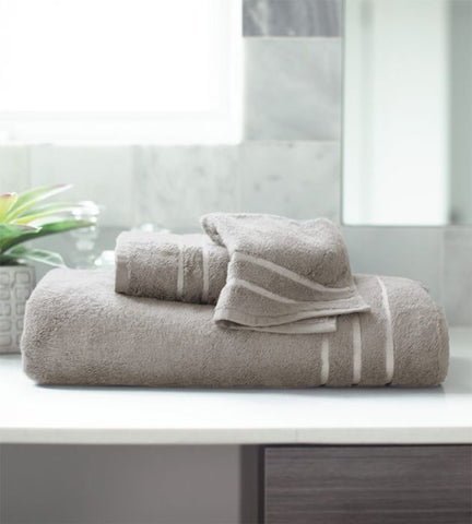 gray bamboo bath towel set on white bathroom counter