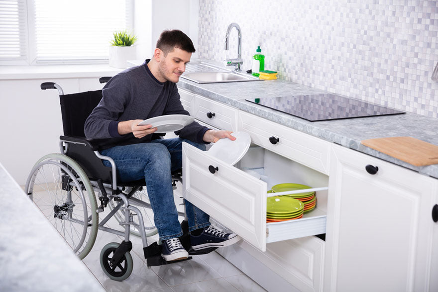 man wheelchair kitchen drawer