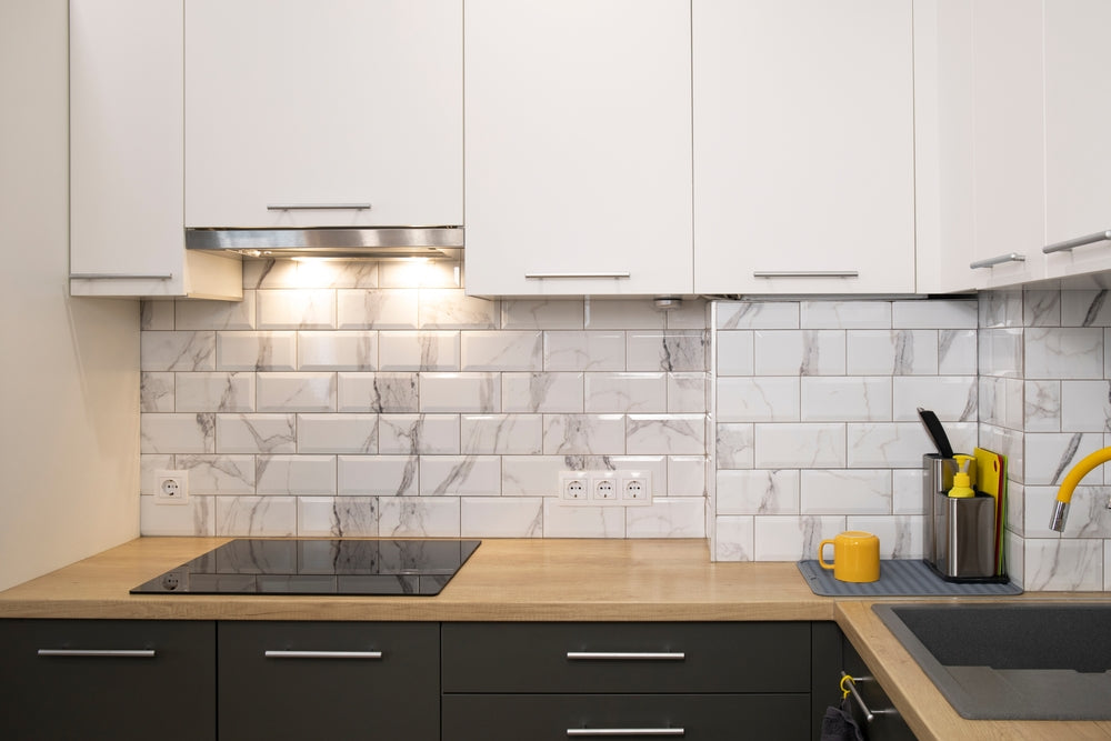 modern kitchen with white cabinets