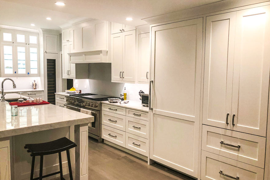 white kitchen design glass cabinet island