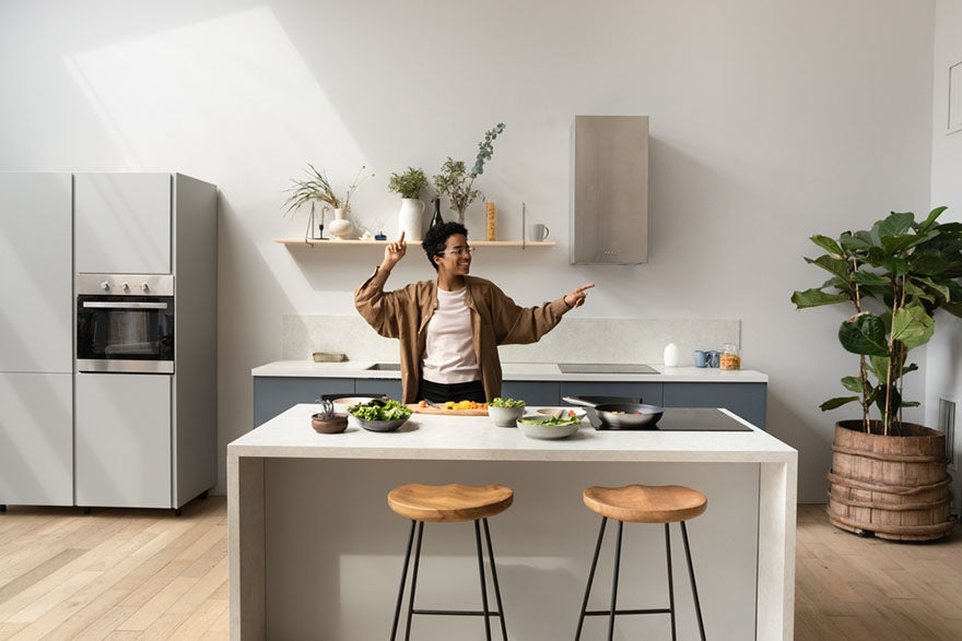 woman dancing by kitchen island