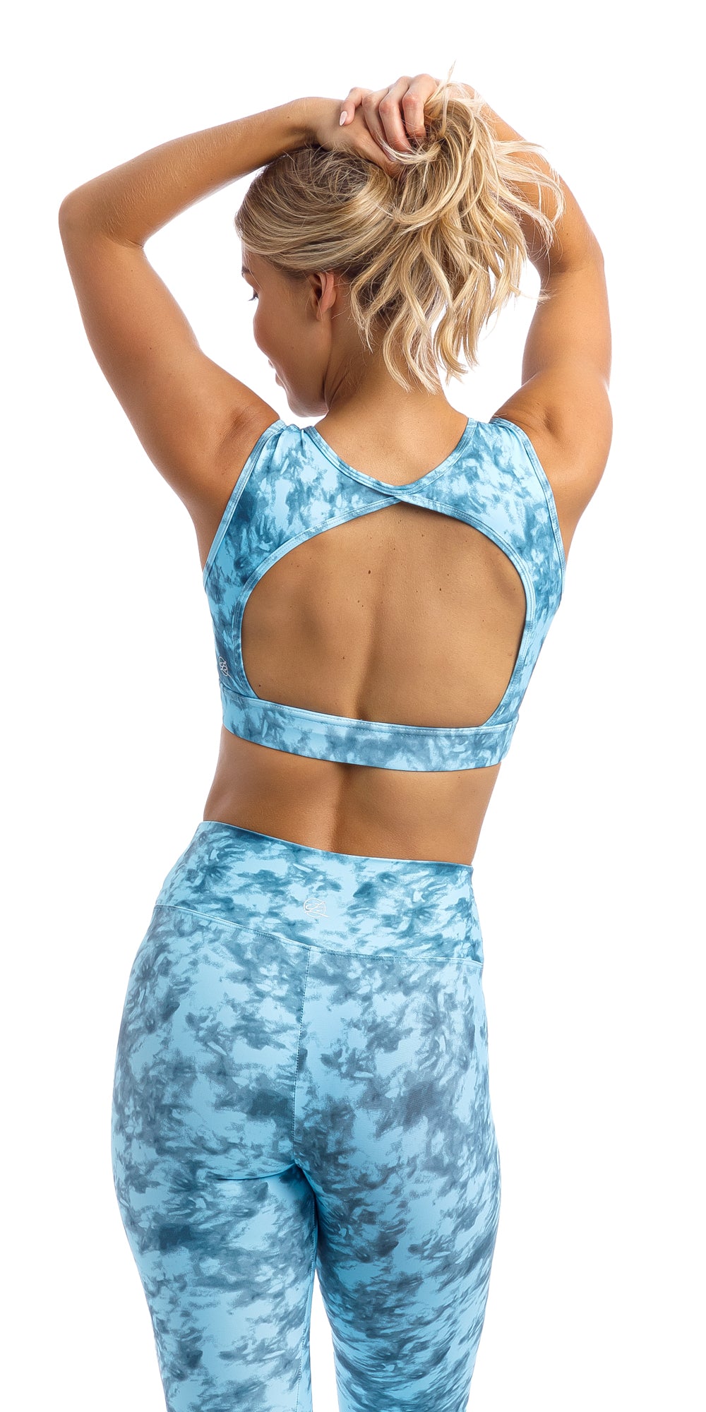 Girl in blue tie dye blue crush print rhythm bra with cut out back & matching ultra high waist leggings