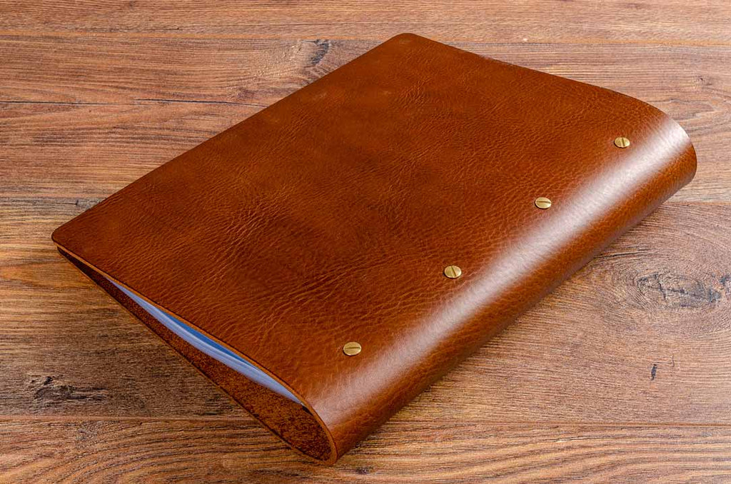 the screw posts attach to the leather menu through the back cover