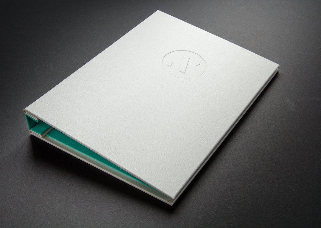 A4 Designers portfolio book in Ivory buckram and Brannan green inner bookcloth and spine cover with a blind deboss personalisation