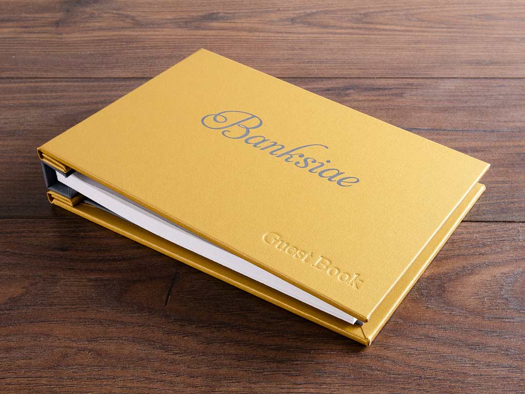 Personalised visitors book in with grey foil and blind embossing by hartnack and co