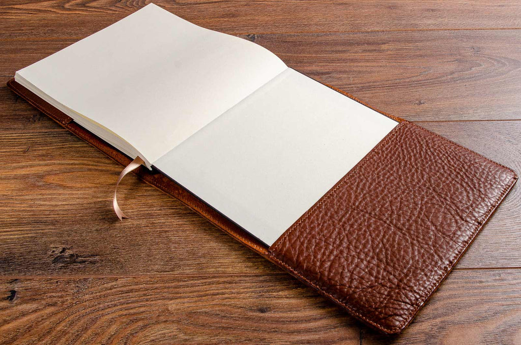 The hard cover book fits snugly and securely into its hand stitched leather book jacket