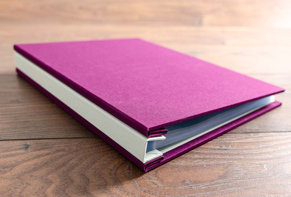Hidden screw post portfolio in Harlech purple and Lichen green book cloth