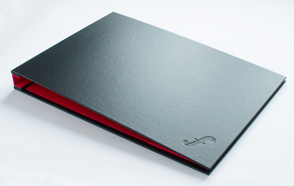 A3 Graphic designers portfolio in Black buckram and Alton red book cloth with blind deboss personalisation