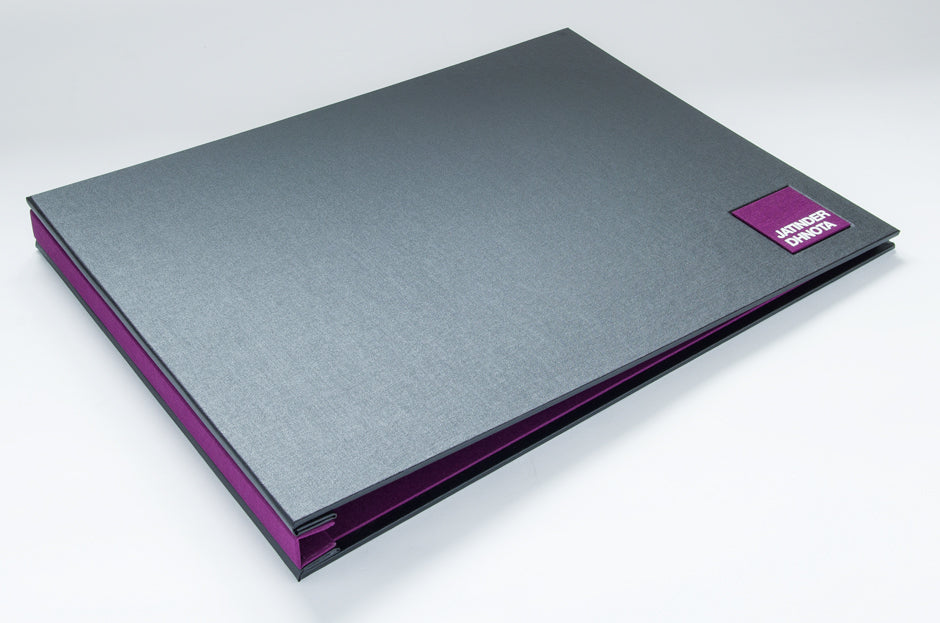 A3 landscape portfolio in Charcoal buckram and Harlech purple book cloth with square name plaque