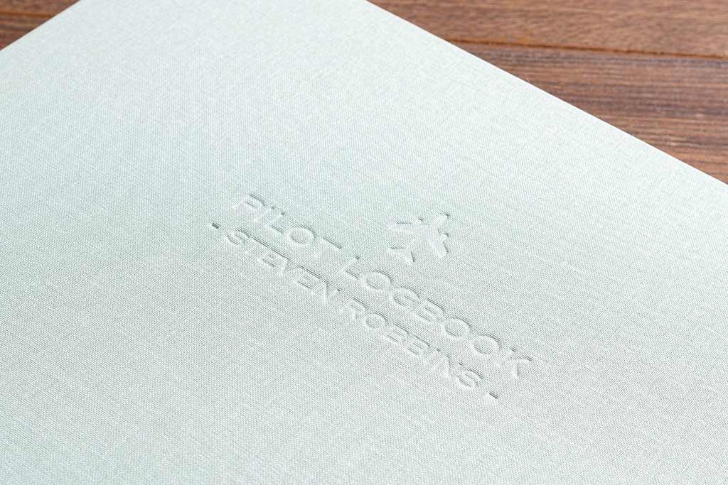 personalised blind embossing on the cover of a custom made pilots logbook