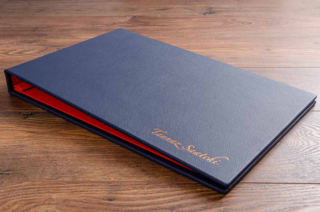 11x17 landscape format photography portfolio book in blue leather and rose gold foil embossed personalisation