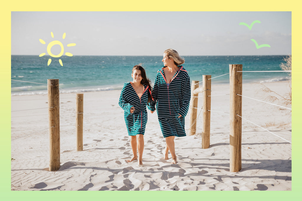 Mother and daughter walking on the beach wearing their Swoodi's