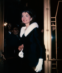 Jackie was all glamour in a fur ruff and matching evening gloves on a night out