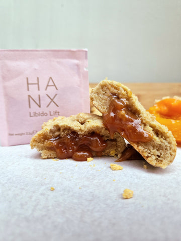 HANX Libido Lift Supplement next to a cookie with a gooey peach filling