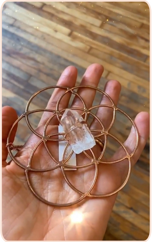 rose gold crystal grid with quartz point