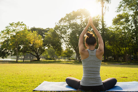 woman stretching in the sun