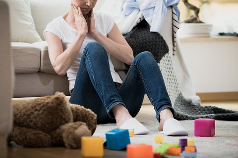 person suffering from adhd sitting on the floor