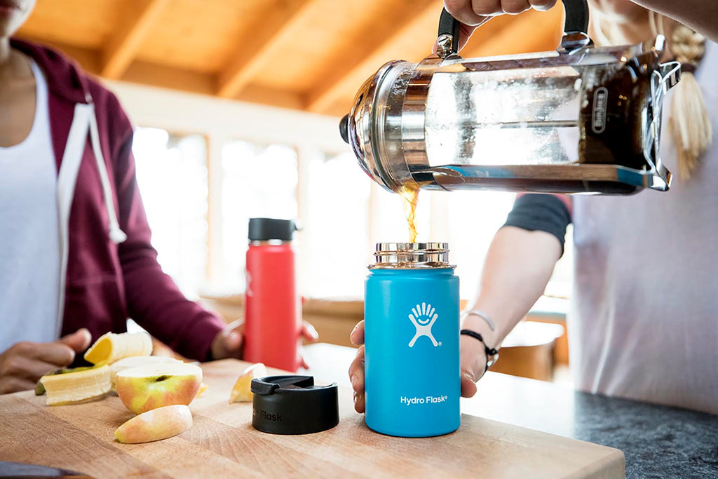 Man pours coffee into a Hydro Flask vacuum flask