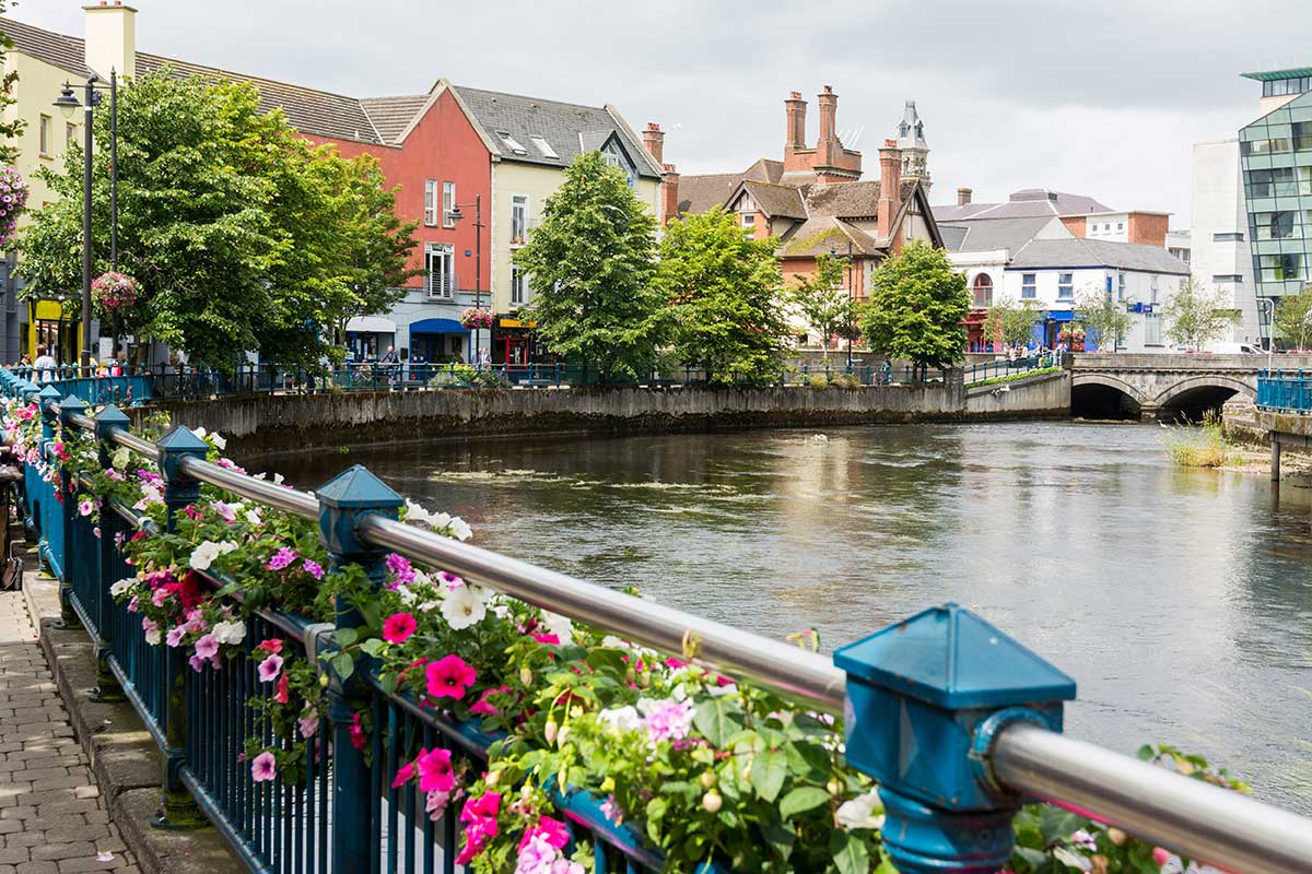 Sligo Town in County Sligo, Ireland, with flowers, the river, pubs and shops.