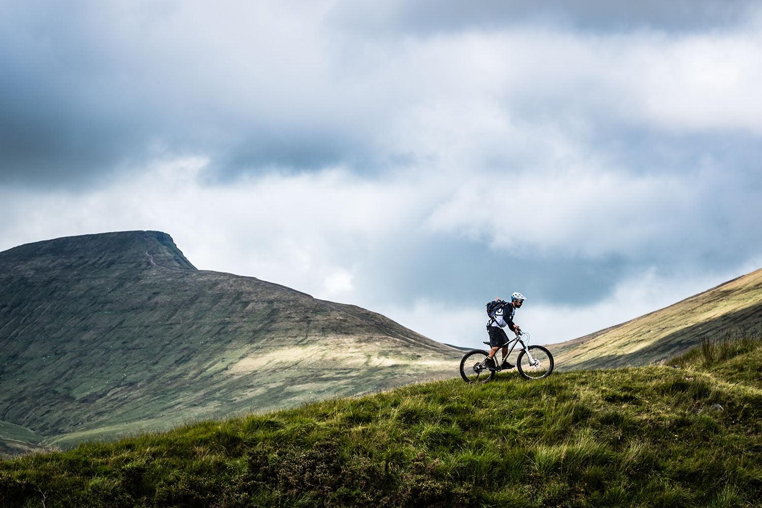 Mountain biking in the Brecon Beacons - lone rider against an epic view