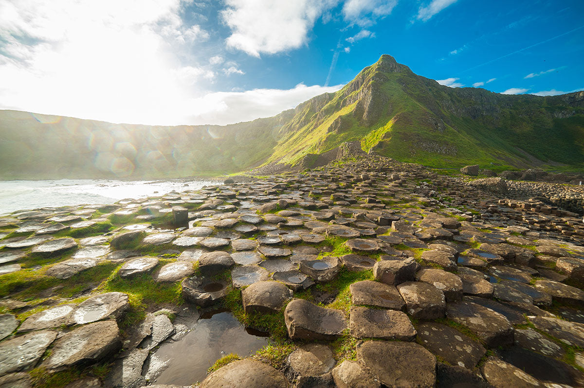 A wide angle shot of the Giant’s Causeway at dawn on a sunny day in County Antrim, Northern Ireland.