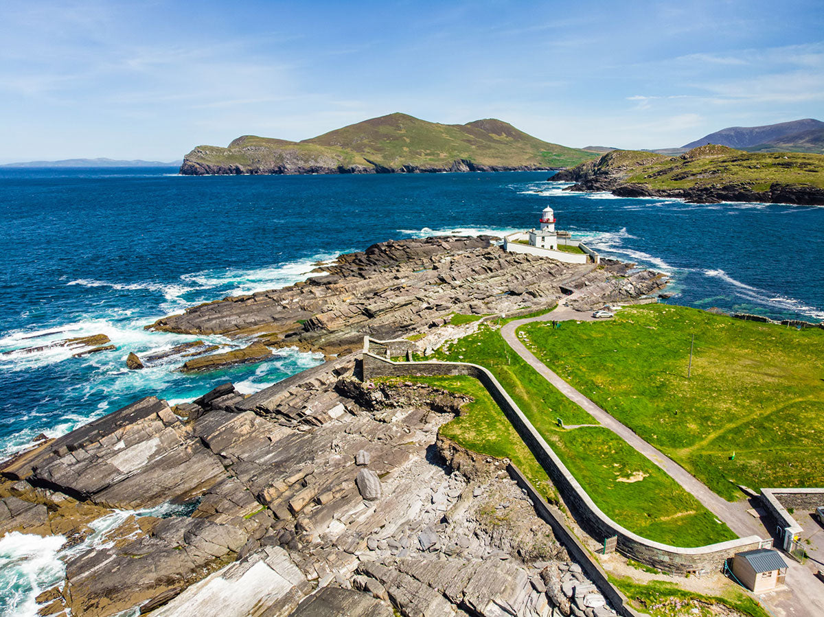 A landscape view of Valentia Island lighthouse and the coastline at Cromwell point, County Kerry, Ireland.