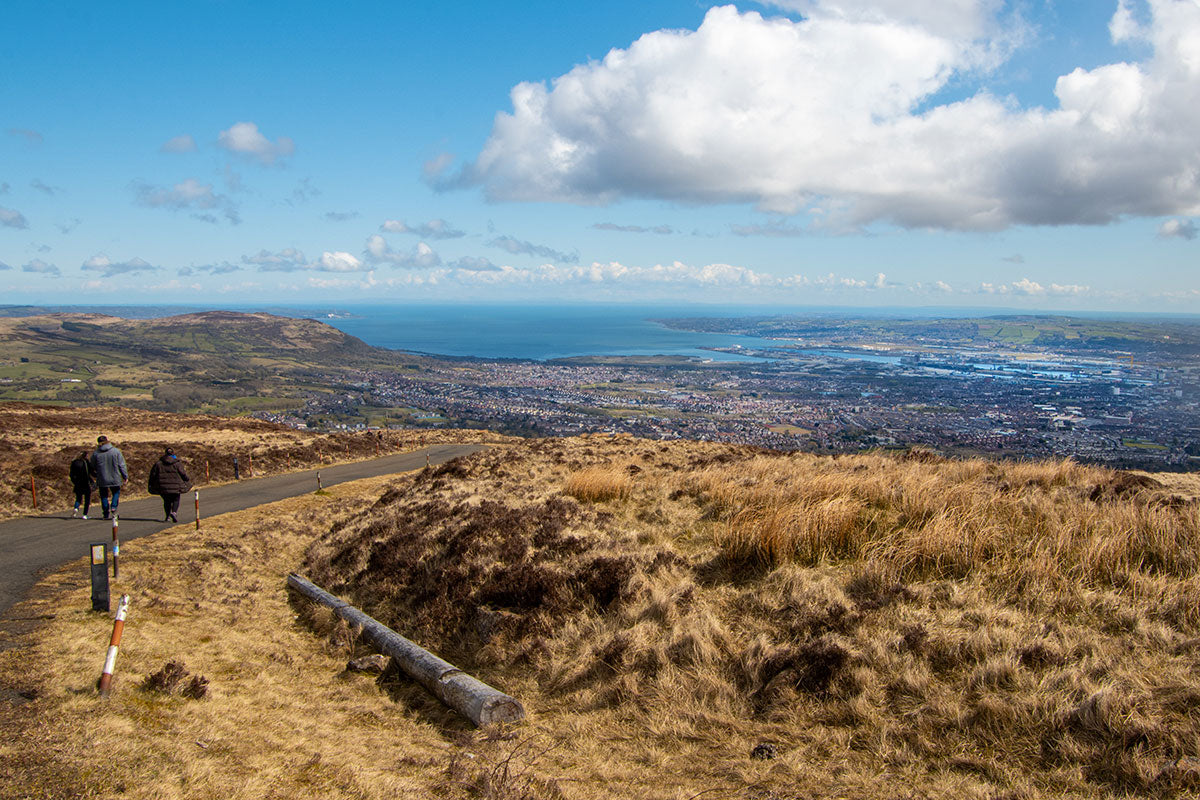 Views of Belfast City and hikers from the top of Divis and the Black Mountain on a sunny and cloudy day