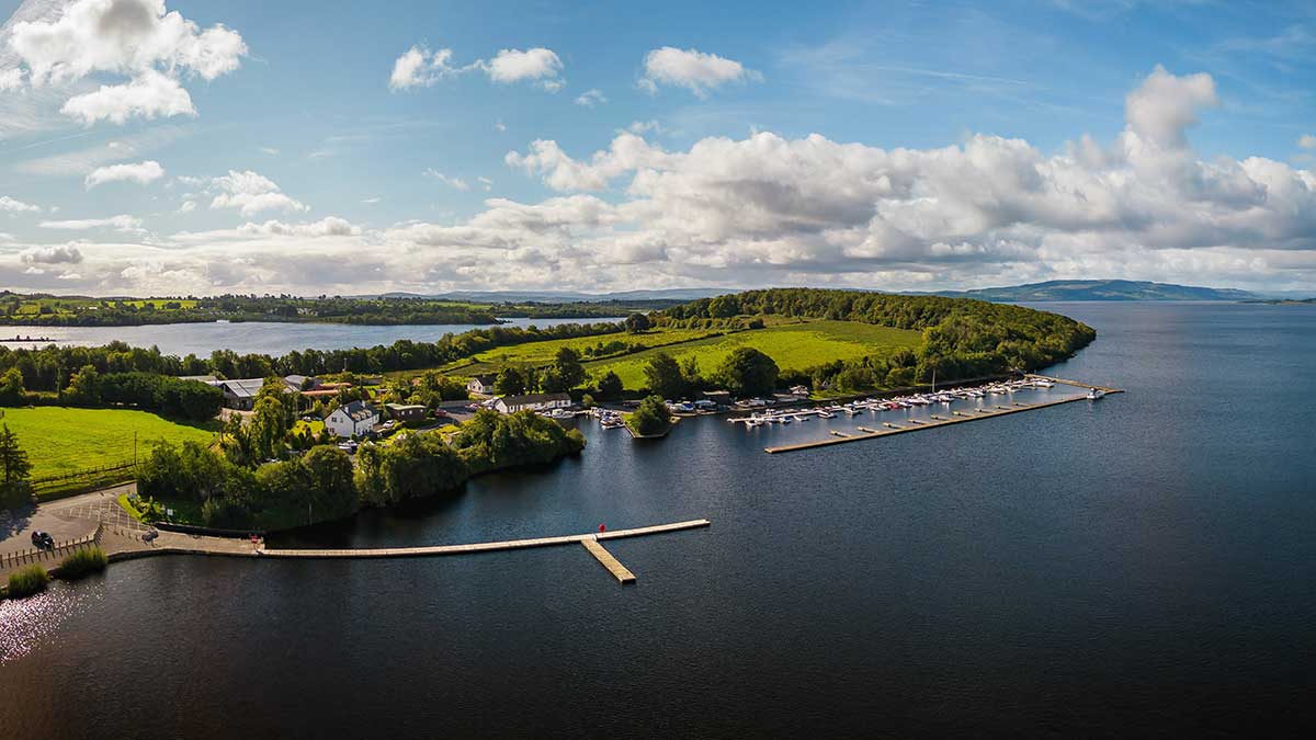 An aerial view of Lough Erne and a jetty of parked boat in Fermanagh, Northern Ireland.