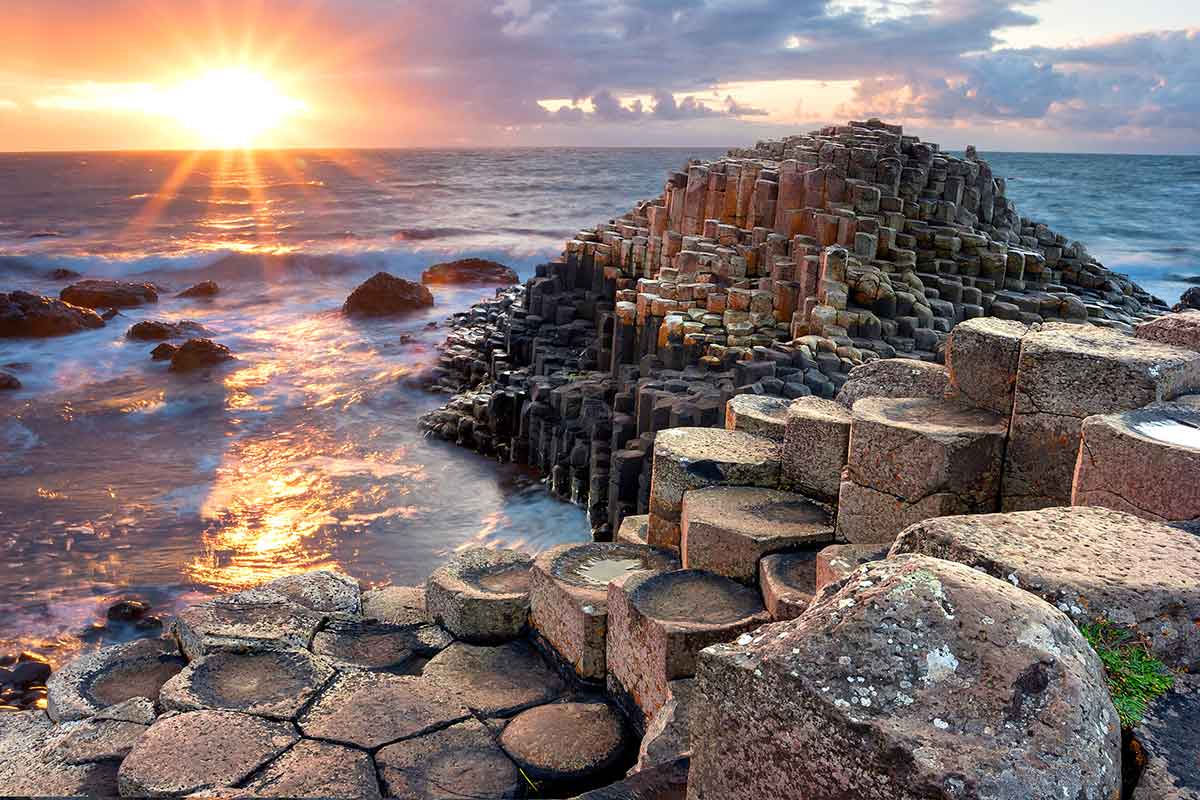 A coastal sunset over the Irish sea by the Giant’s Causeway, Country Antrim, Northern Ireland. 