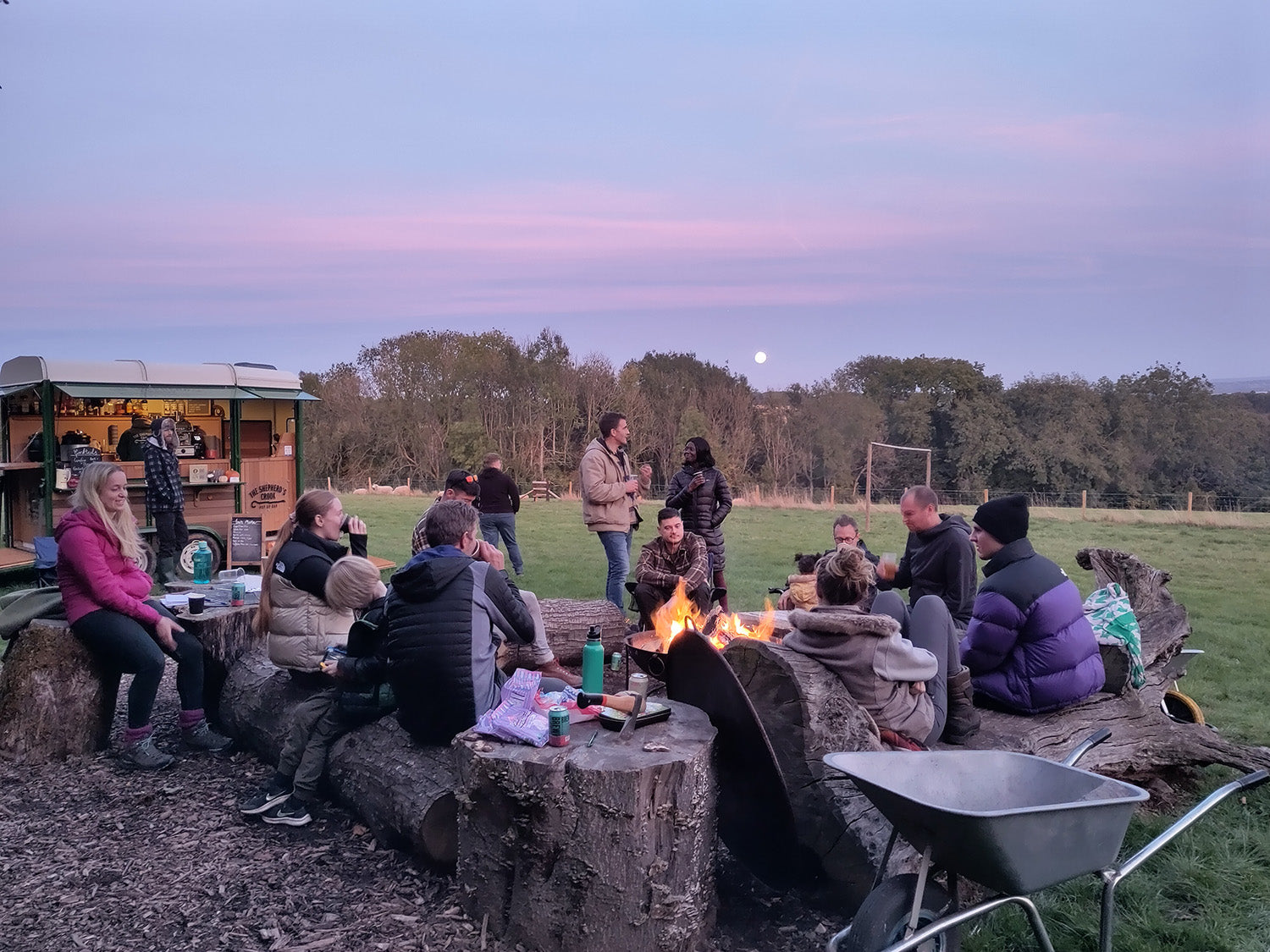 The WildBounds crew gathered around the campfire at Penhein