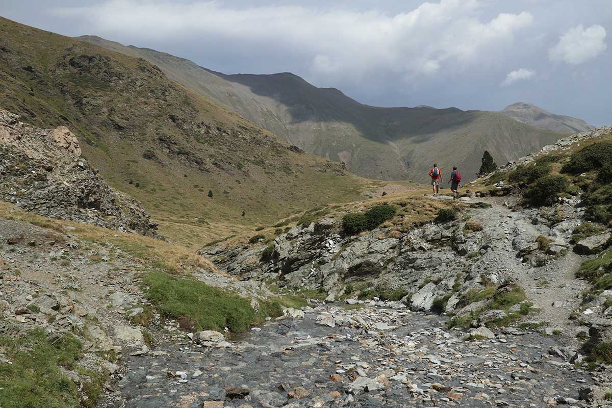 Crossing a stream on the way to Puigmal