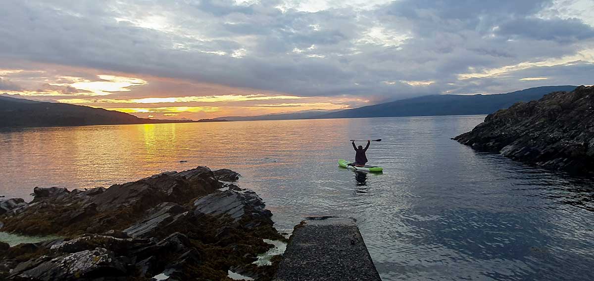 Paddleboarding at sunset.