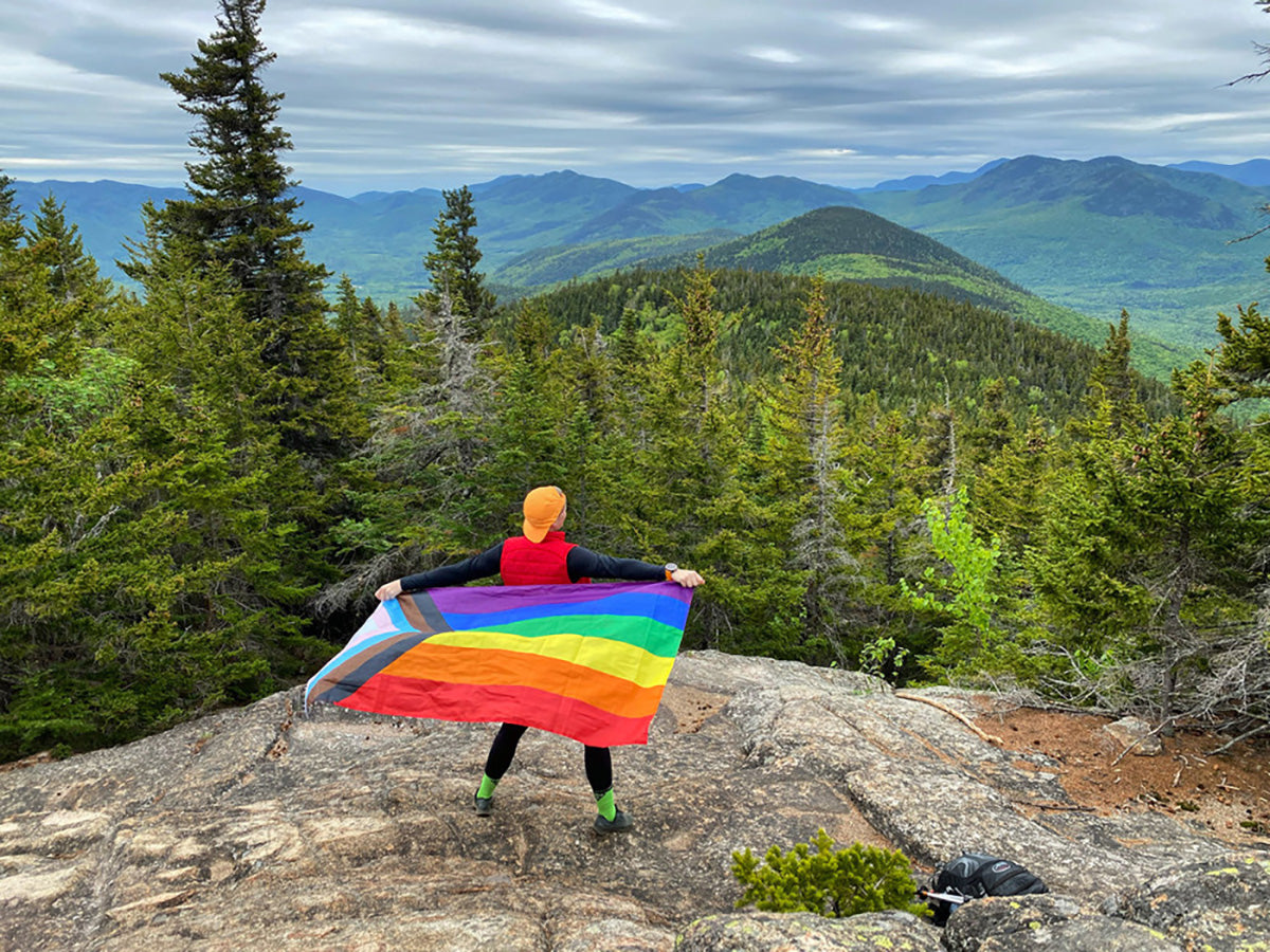 Queer Outdoor Holding a Flag