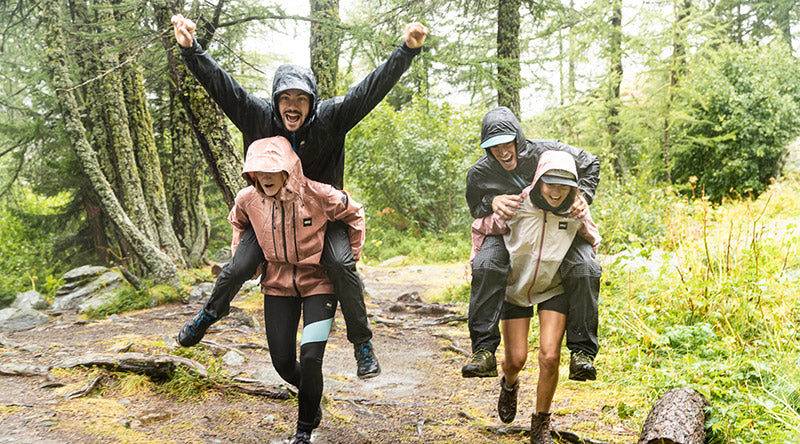 Four friends wearing Picture Organic Clothing, having fun in the woods