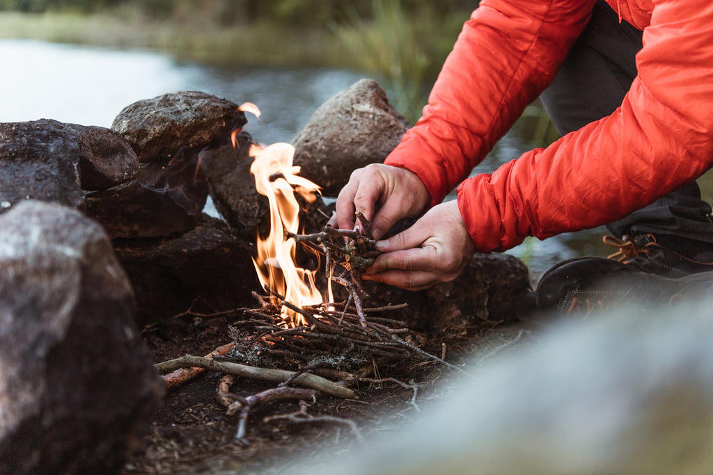 Lighting a small stick fire in Sweden