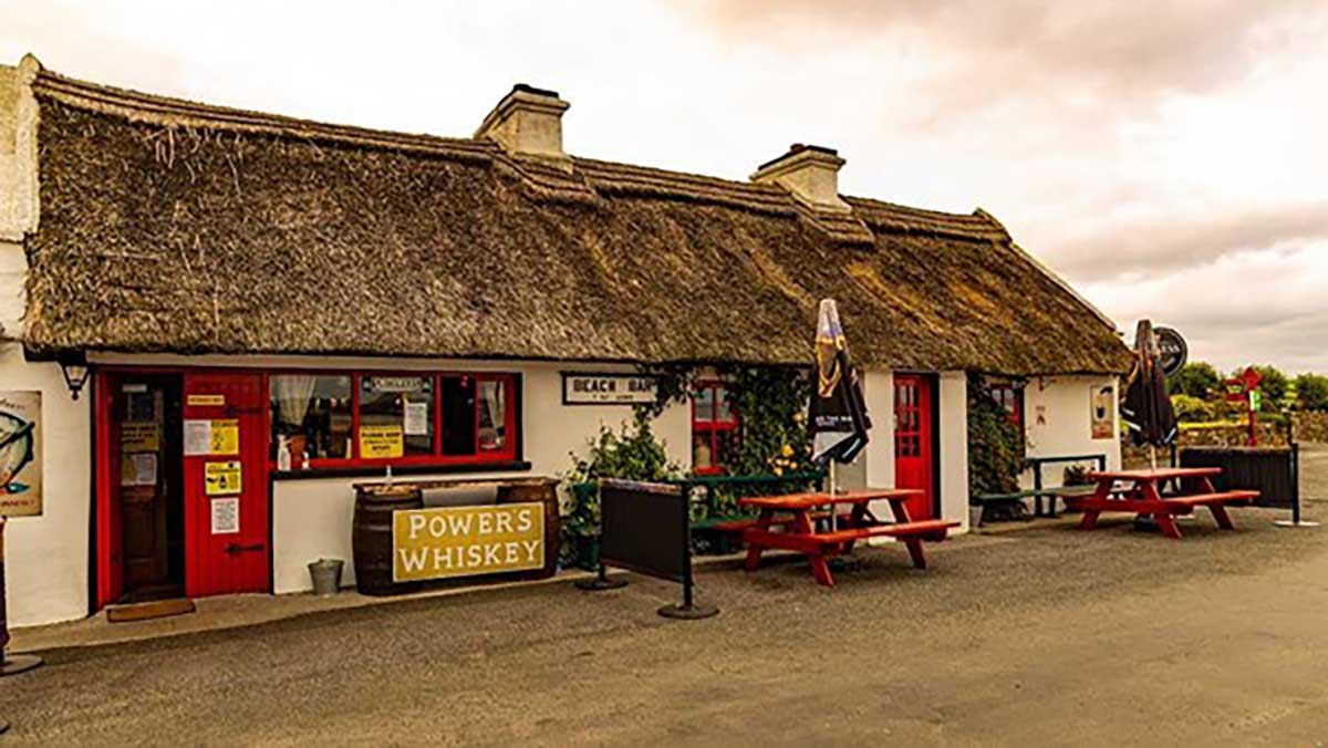 The Beach Bar with a thatched Irish roof at Aughris Head in County Sligo, Ireland.