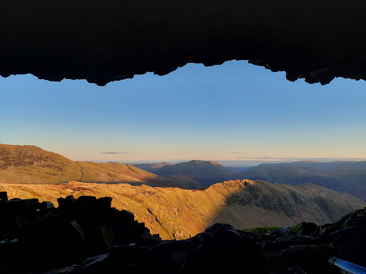 Watching sunrise from a rock shelter in the Lake District