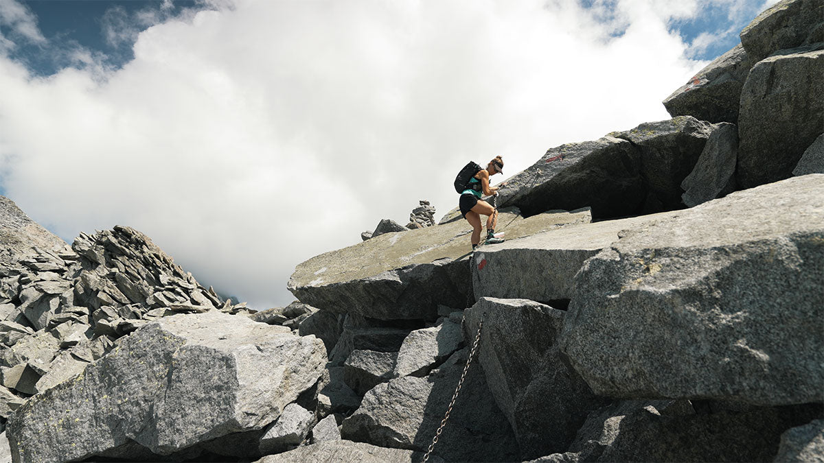 Woman climbing Val Masino