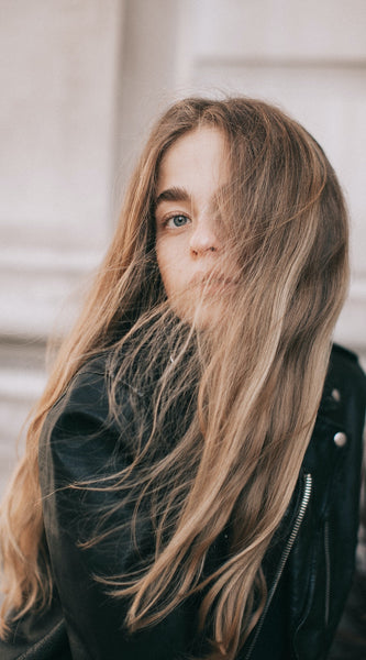 Blonde girl with beautiful thick hair