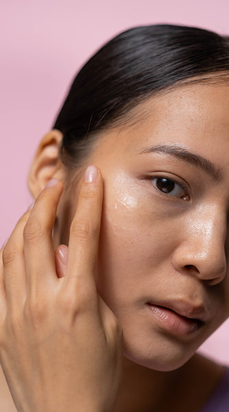 Woman applying moisturizing gel on face, fall skincare, tips to prevent dry skin