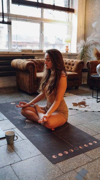 woman meditating at home