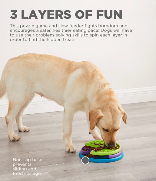 The Lickin' Layer puzzle game has three layers of food compartments that dogs need to navigate through by spinning each one to reveal the treats. Puzzle has over 100 treat compartments to keep your dog busy and engaged, and is large enough to use as a slow feeder.