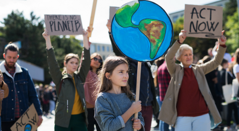 people protesting climate change with various signs