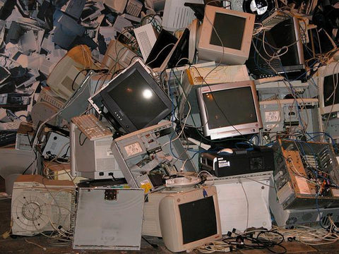 electronic computer monitors and other electronic wires and parts stacked in a pile for garbage